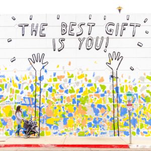 wall with graffiti saying the best gift is you for annual appeal