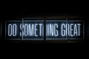 Neon sign saying Do Something Great which is possible when you have self-awareness